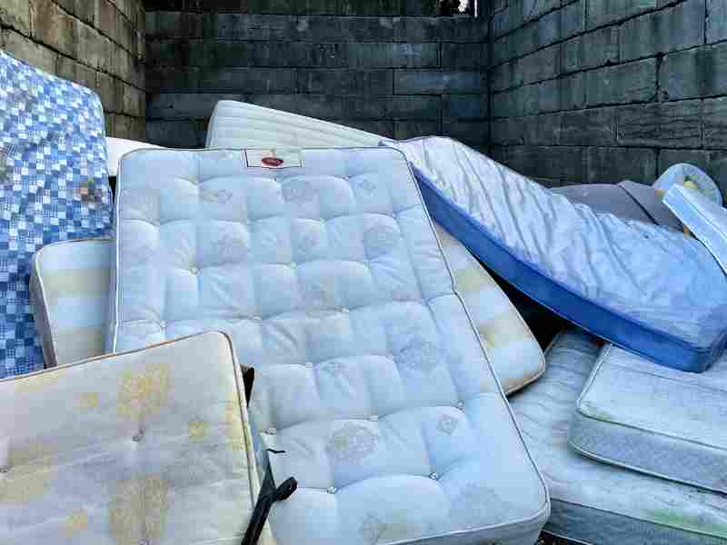 Discarded old mattresses for disposal