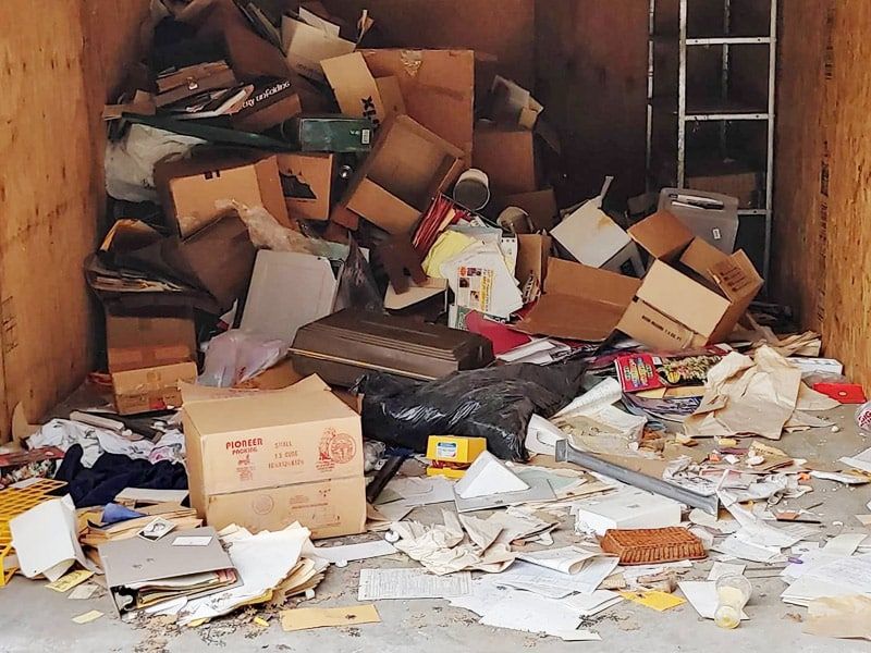 Overflowing cardboard boxes and papers